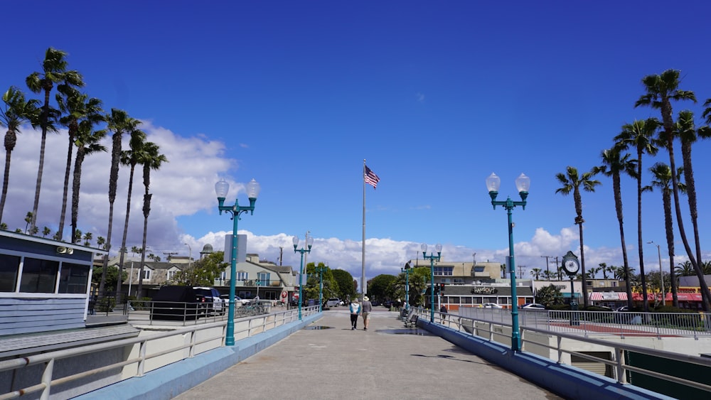 people walking on sidewalk during daytime