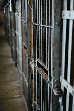 Detailed close-up of the prison’s barred cell windows, showcasing the heavy ironwork.