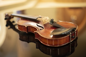 a close up of a violin on a table