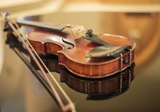 a close up of a violin on a table