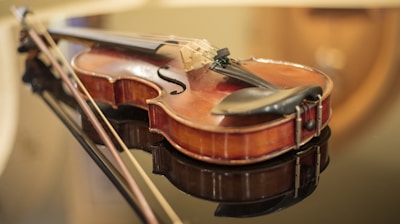 a close up of a violin on a table