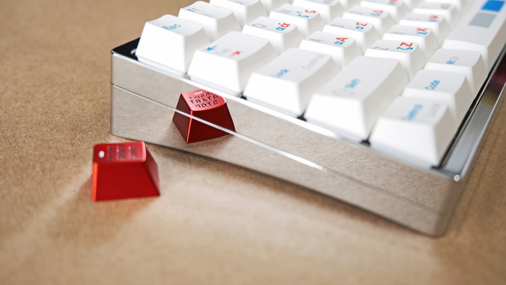a computer keyboard and a pair of red dice
