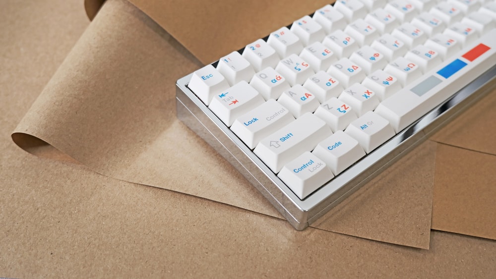 a computer keyboard sitting on top of a cardboard box