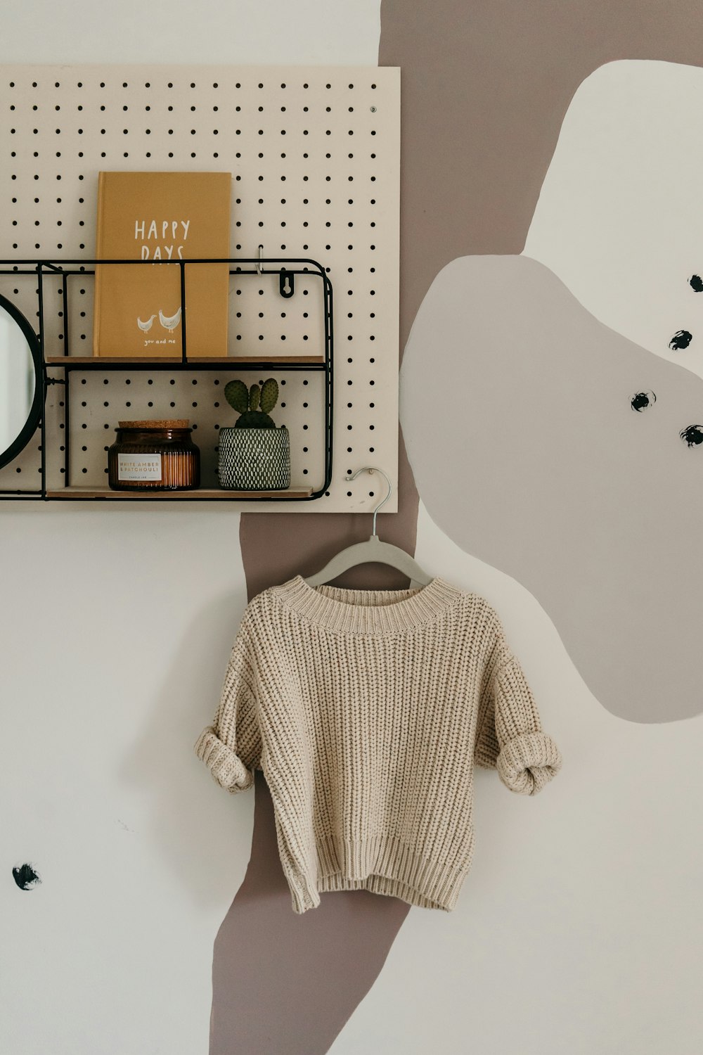 white and brown wooden wall mounted shelf