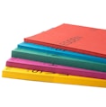 a stack of colored notebooks sitting on top of each other