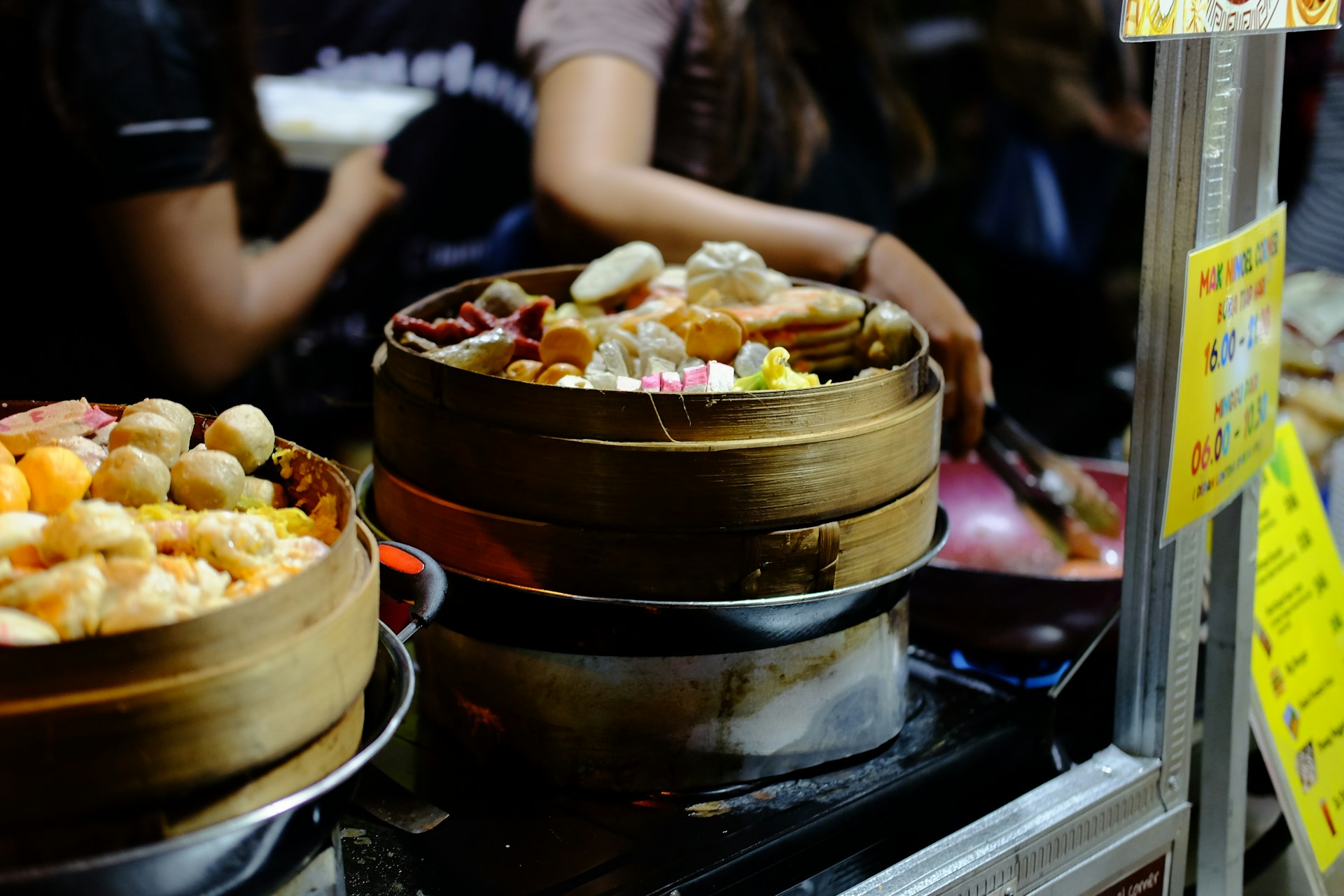 a close up of bowls of food on a stove