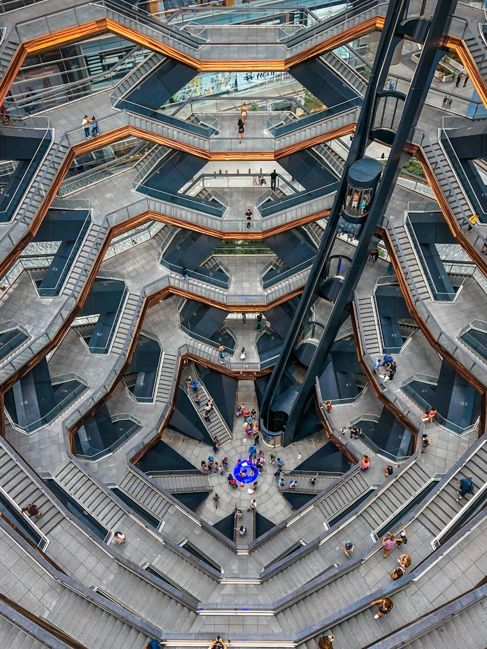 an aerial view of a building with stairs and escalators