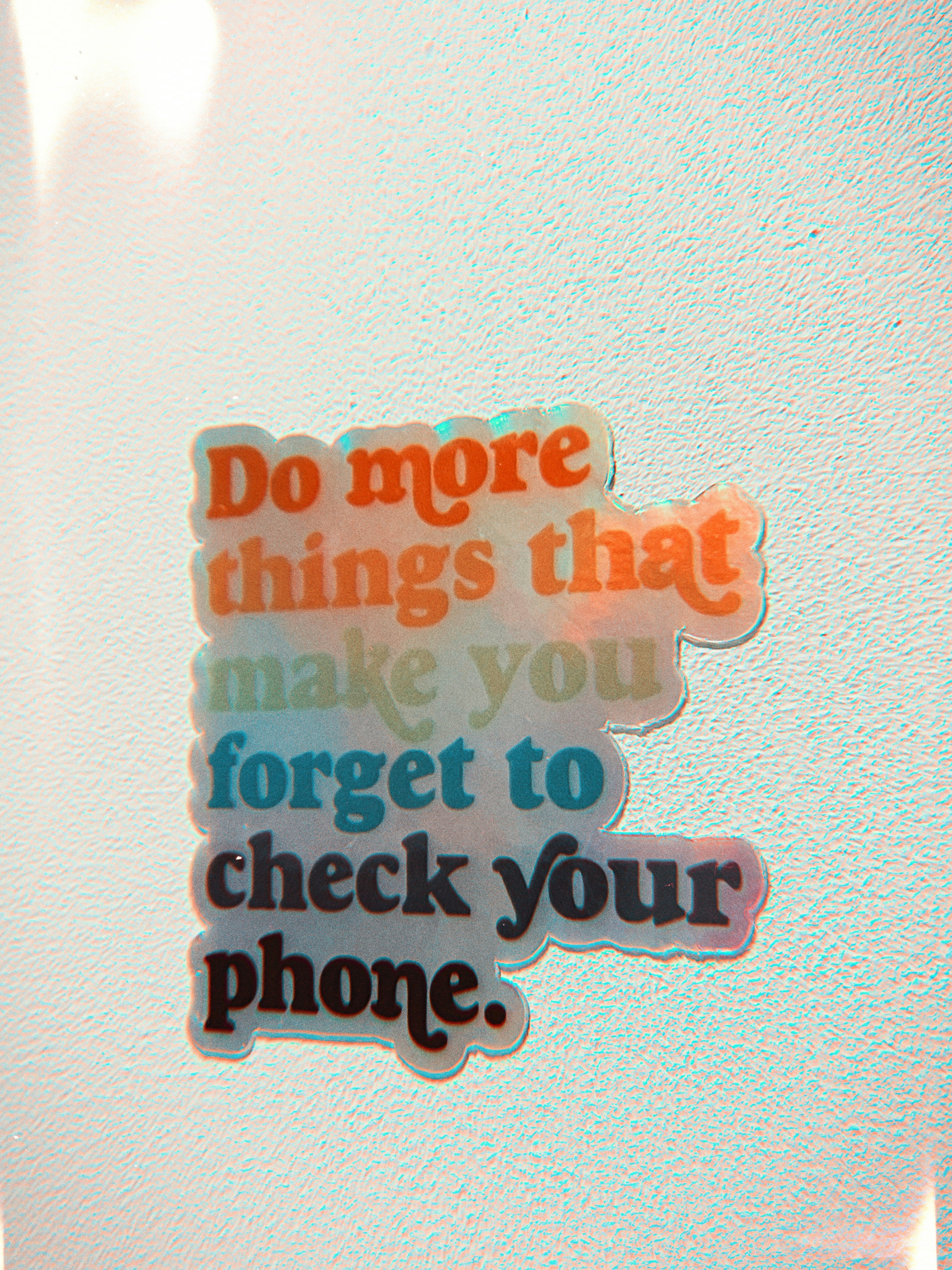 a close up of a cell phone with a sticker on it