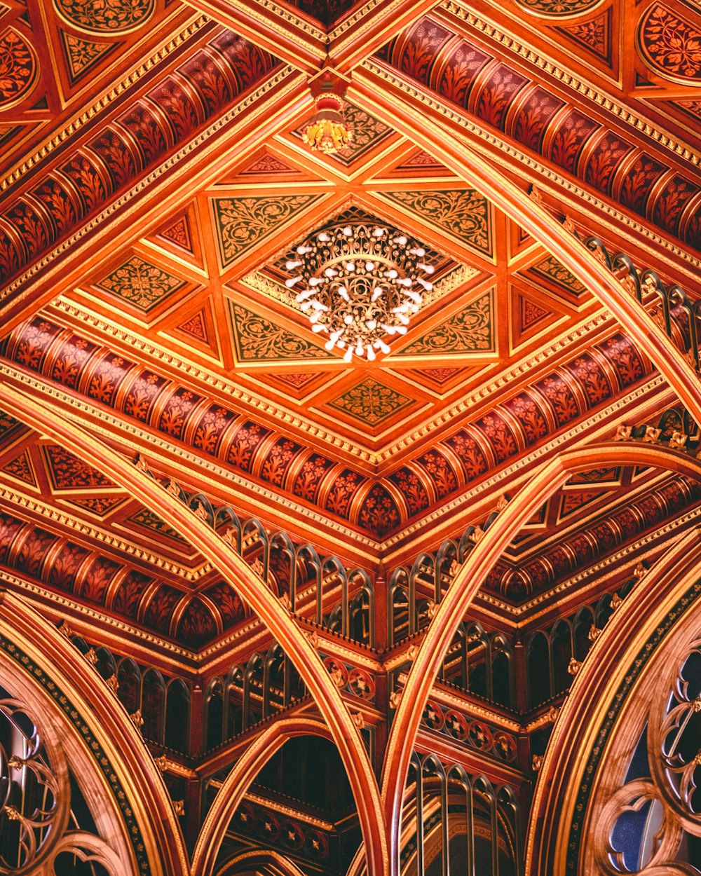 a ceiling with a chandelier hanging from it's center