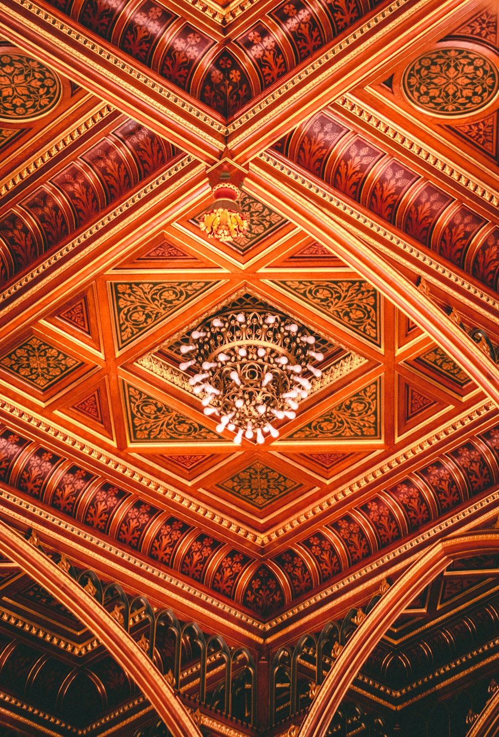 a ceiling with a chandelier hanging from it