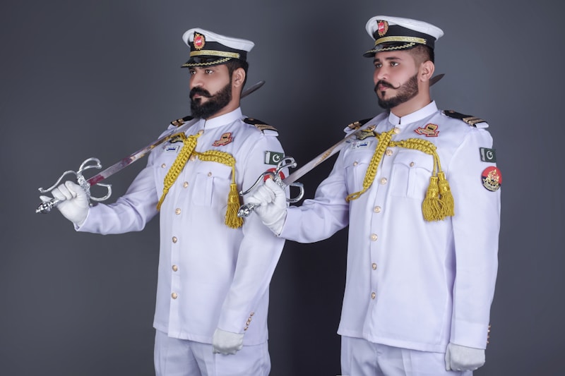 Uniformed gay couple posing