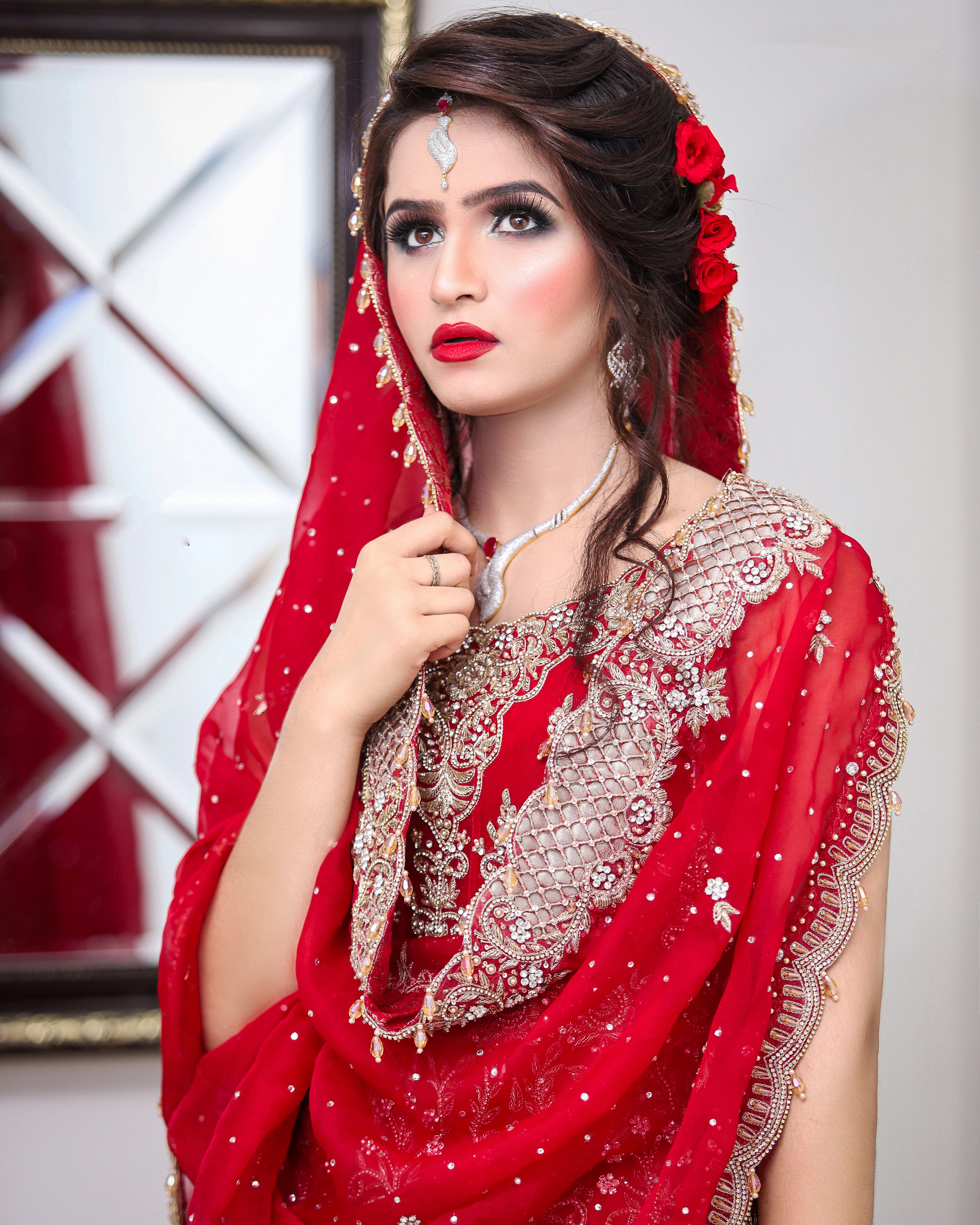 Bride with red roses set in her hair