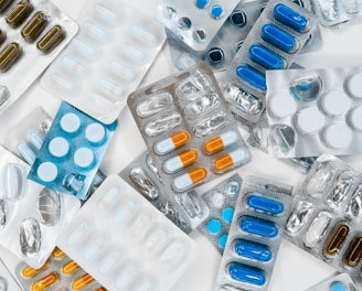 a pile of pills sitting next to each other on top of a table