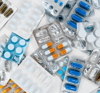 a pile of pills sitting next to each other on top of a table