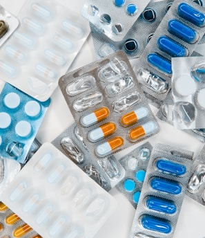 a pile of pills sitting next to each other on top of a table