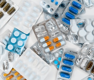 a pile of pills sitting next to each other on top of a table