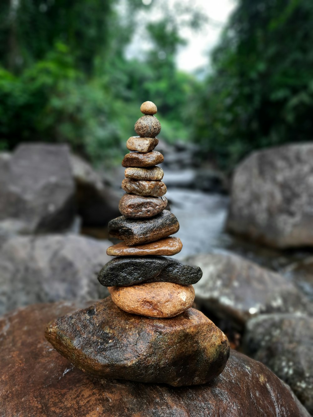 a stack of rocks sitting on top of a rock