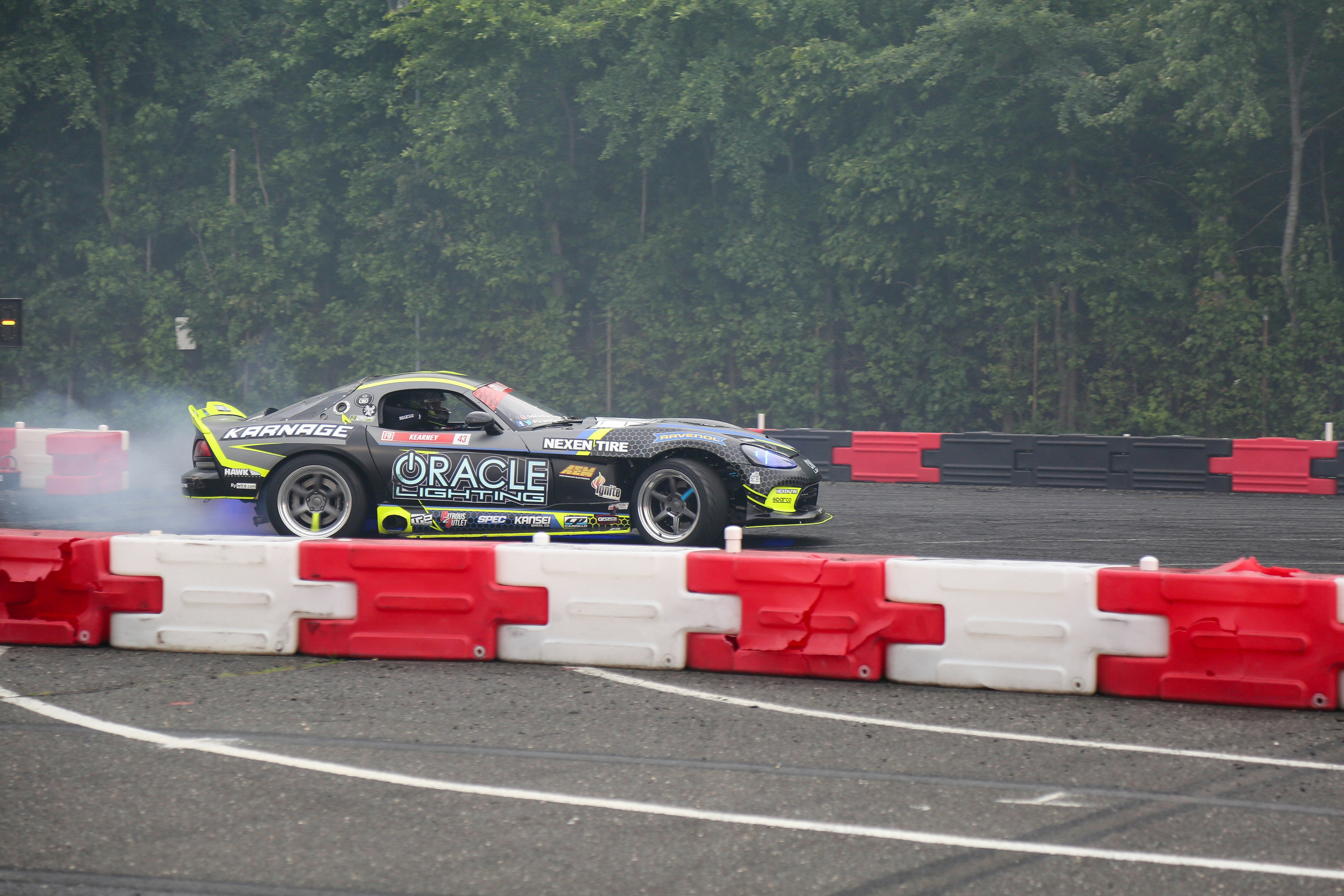 a race car with smoke coming out of it