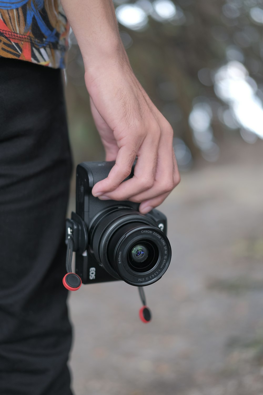 a person holding a camera in their hand