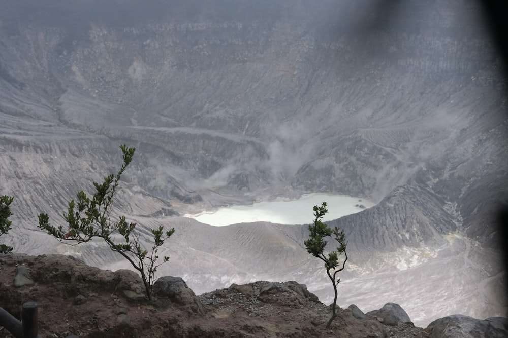 a view of a mountain range with a lake in the distance