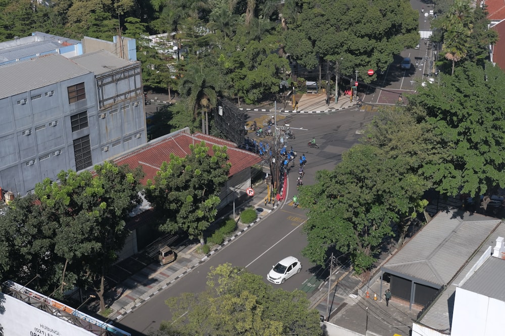 an aerial view of a city street with a white van