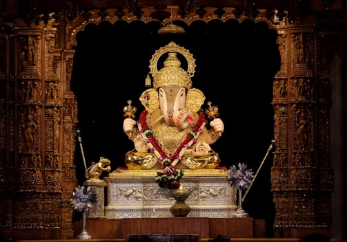A finely carved marble idol of Lord Ganesha with intricate detailing.