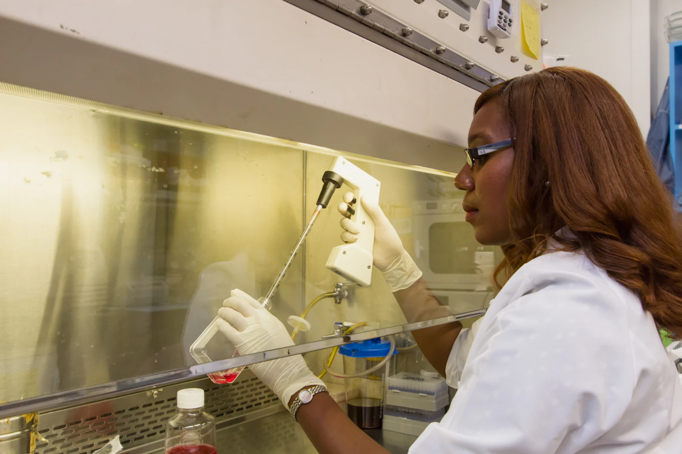 Woman researcher working in a modern manufacturing laboratory environment