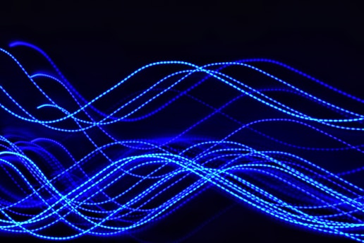 a blurry photo of blue lights in the dark