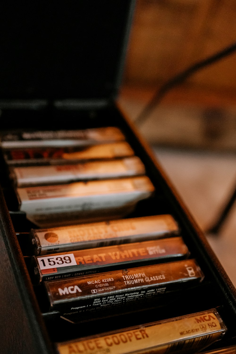 a wooden box filled with lots of different types of cigarettes