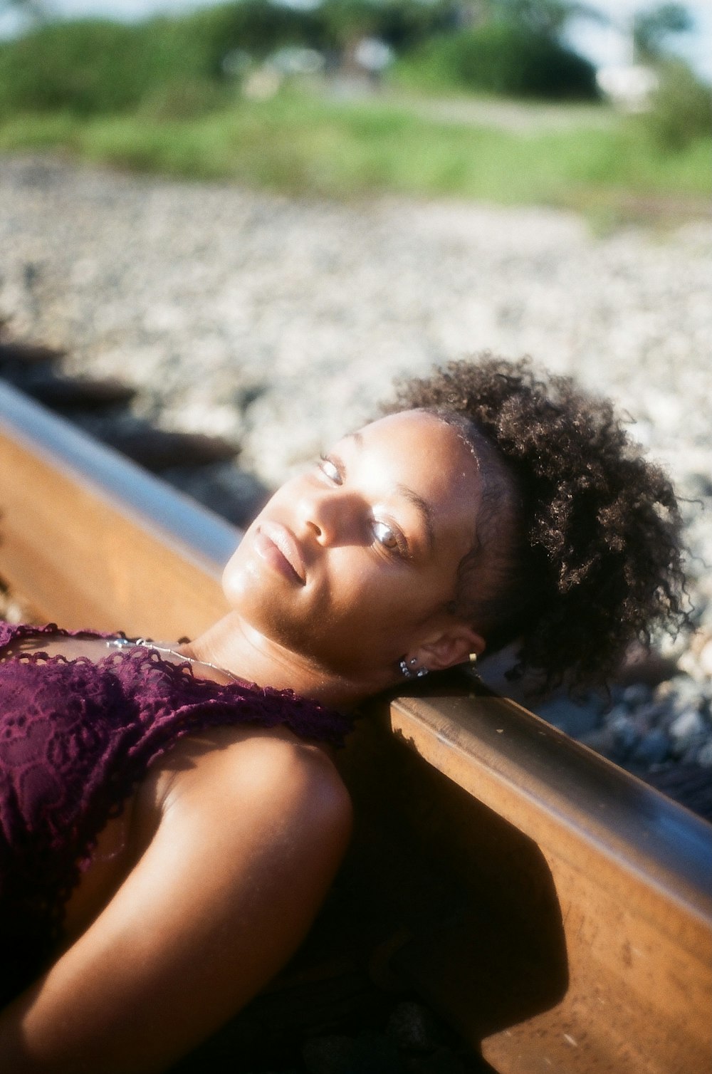 a woman laying down on a train track