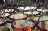 a group of beakles filled with liquid sitting on top of a table