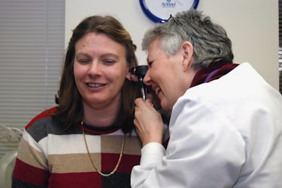 doctor inspecting ear