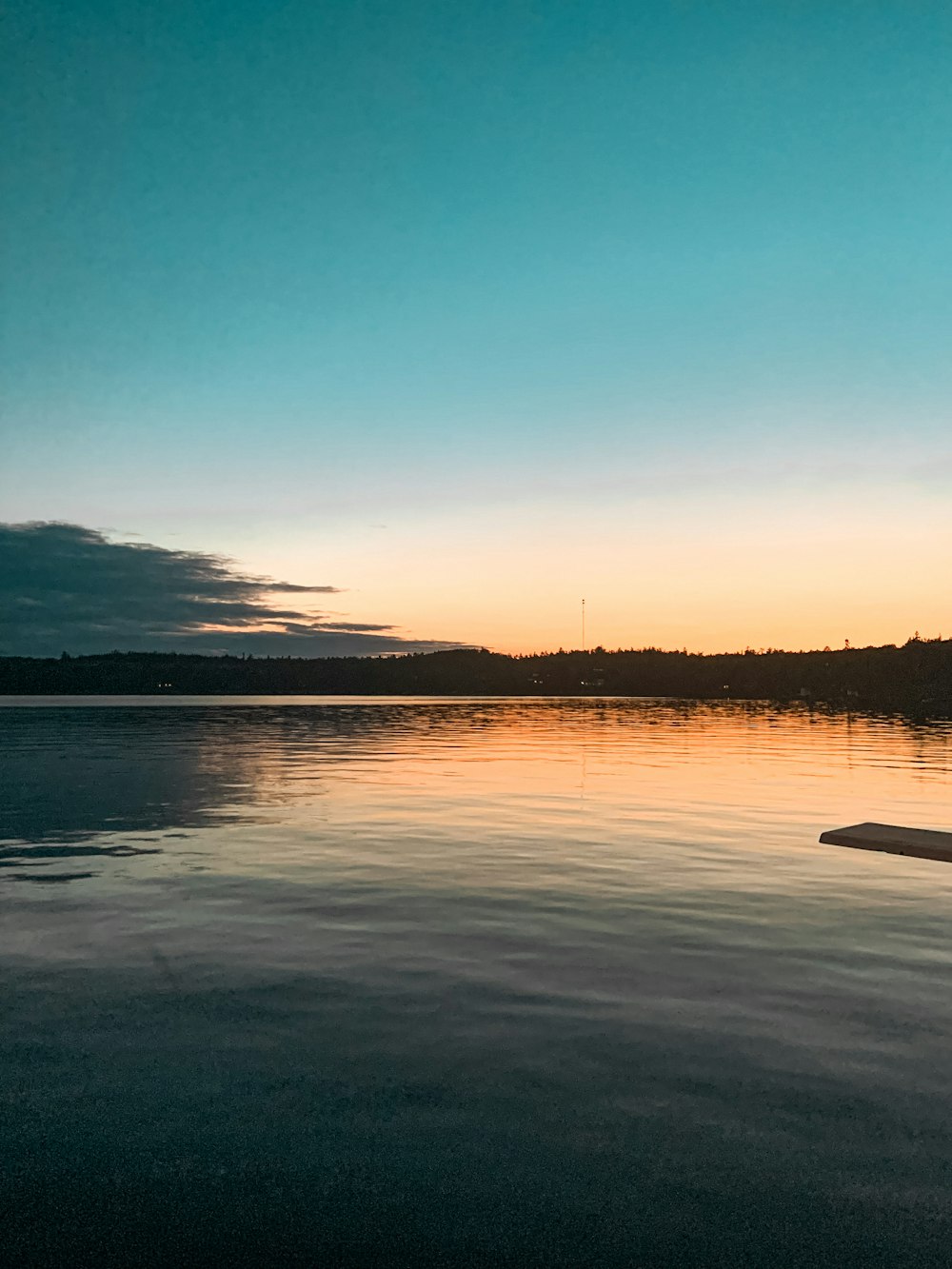 a person standing on a surfboard in the water