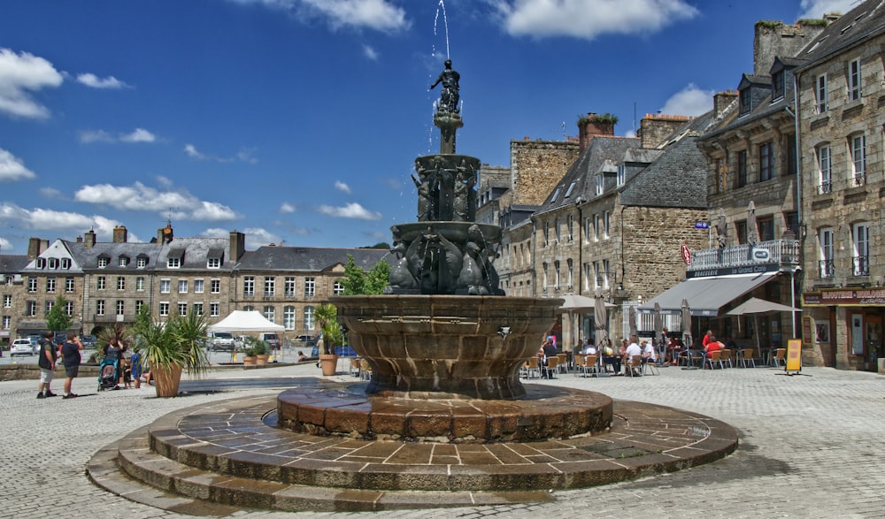 a fountain in the middle of a town square