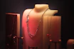 a close up of a necklace on a mannequin