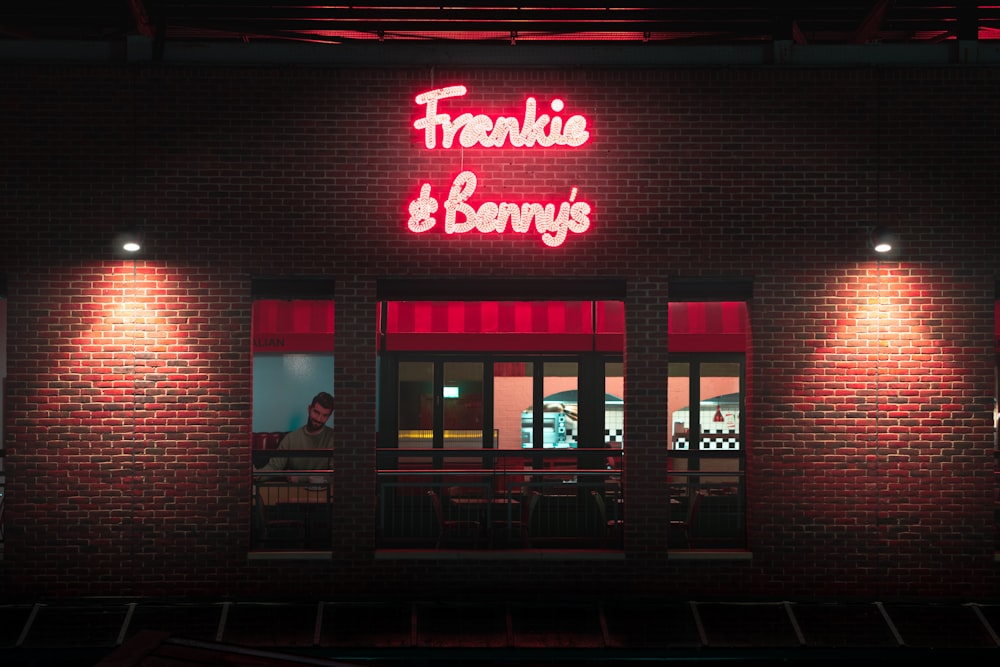 a neon sign on the side of a building