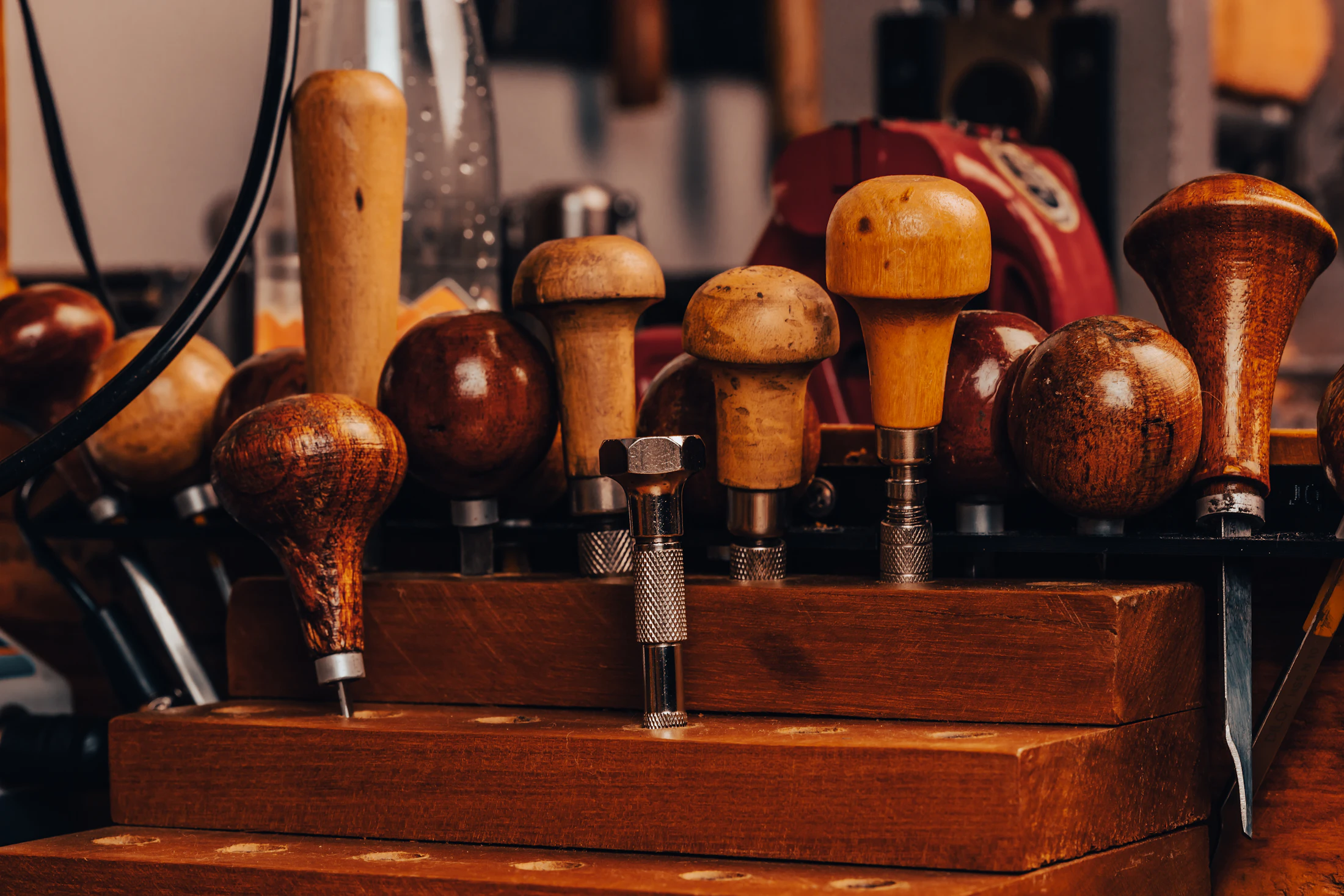 Hand tools on a woodworking bench in a compact workshop