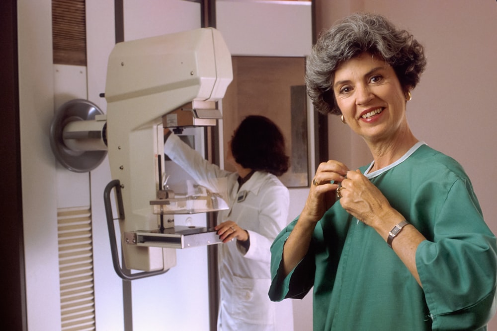 a woman standing in front of a machine