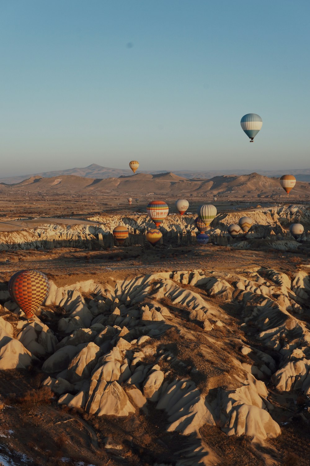 a bunch of hot air balloons in the sky