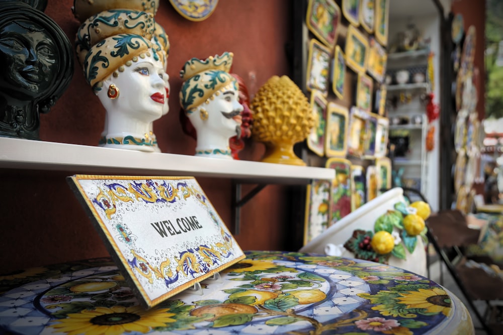 a display of ceramic head sculptures in a store