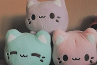 a couple of stuffed animals sitting next to each other