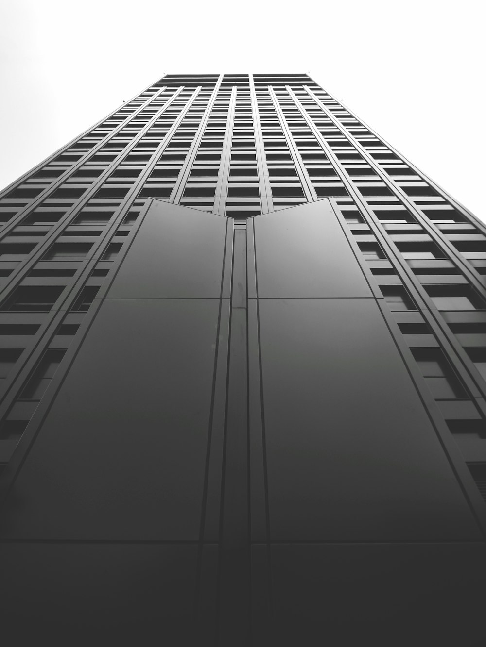 a black and white photo of a tall building