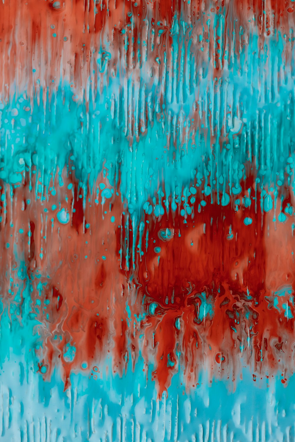 an abstract painting of red and blue colors