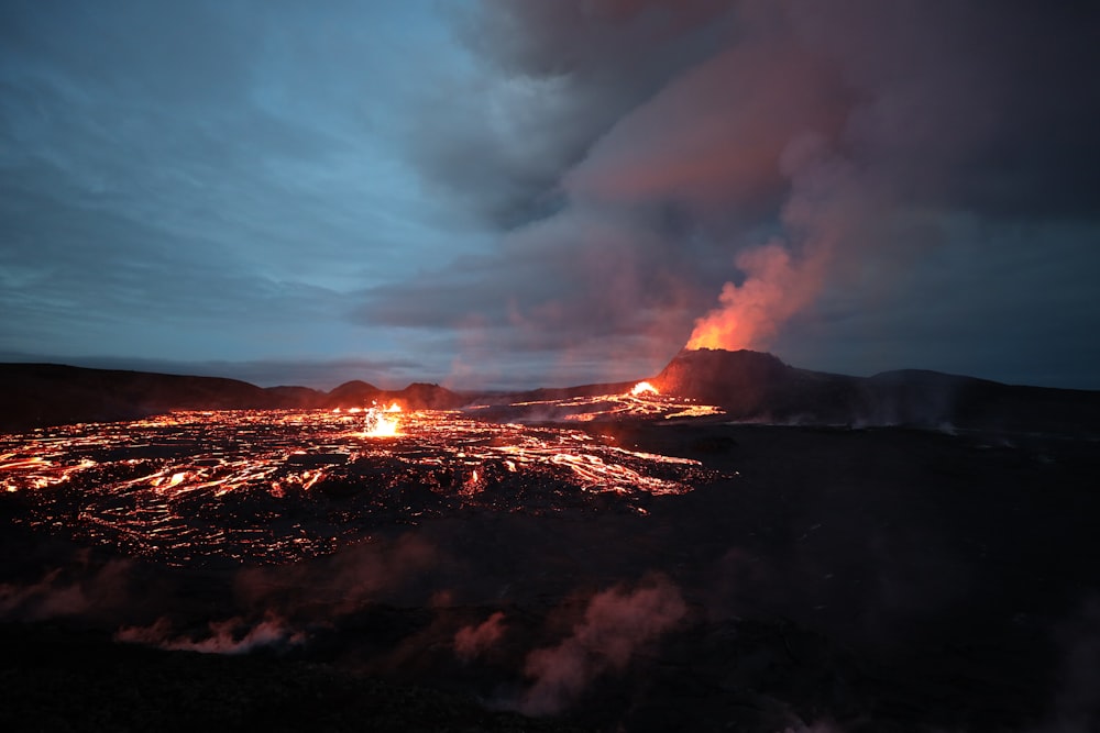 a volcano erupts lava as it erupts into the night sky