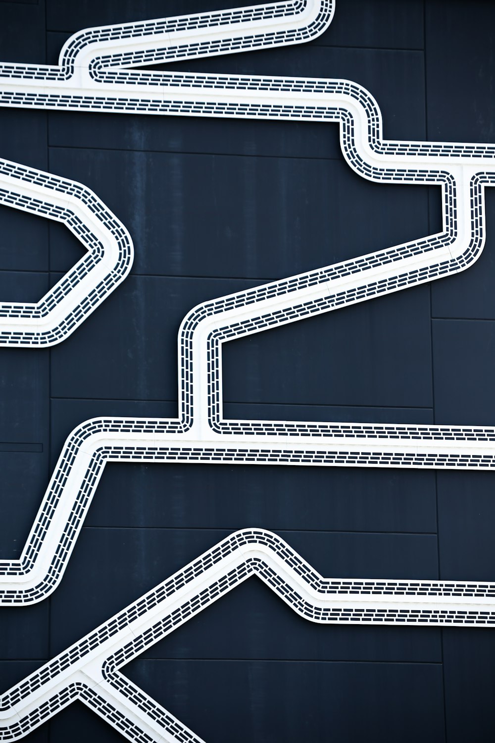 a street sign with a curved road in the middle of it