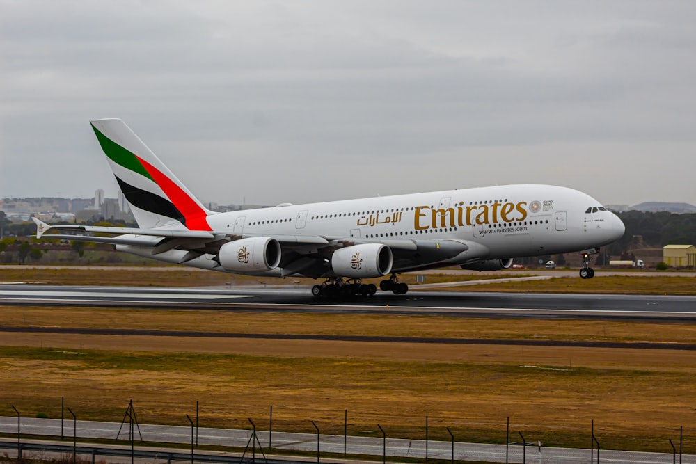 a large jetliner sitting on top of an airport runway