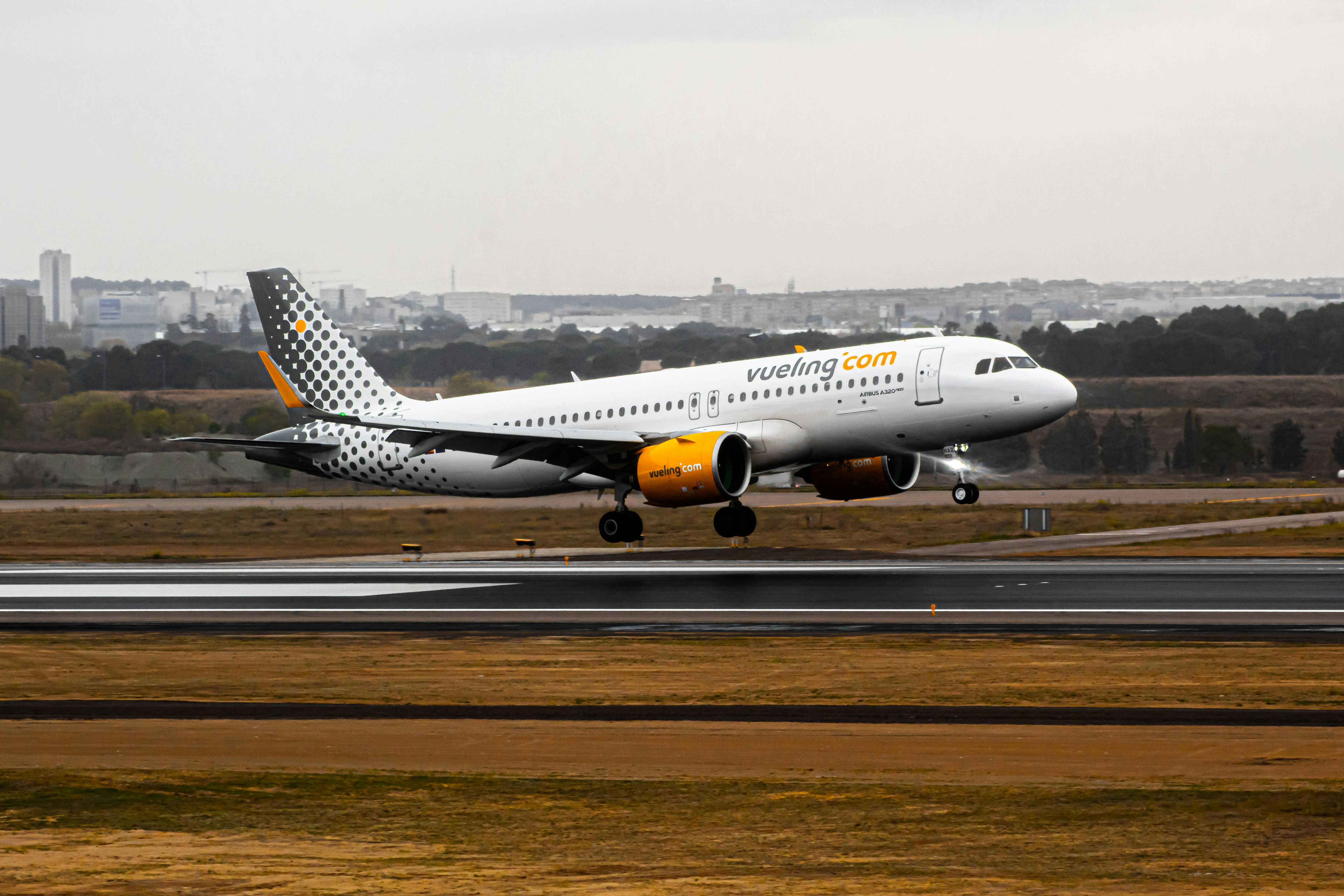 a large jetliner taking off from an airport runway