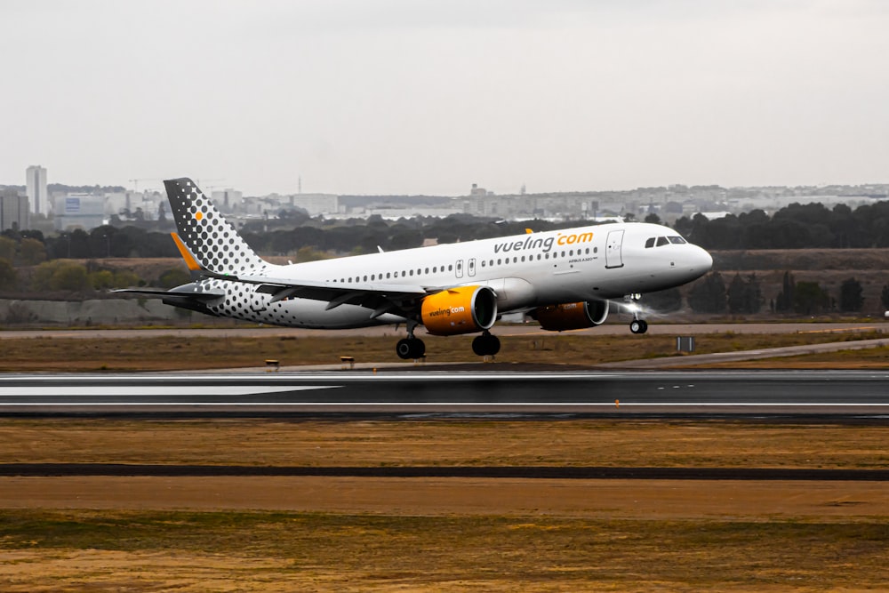 a large jetliner taking off from an airport runway