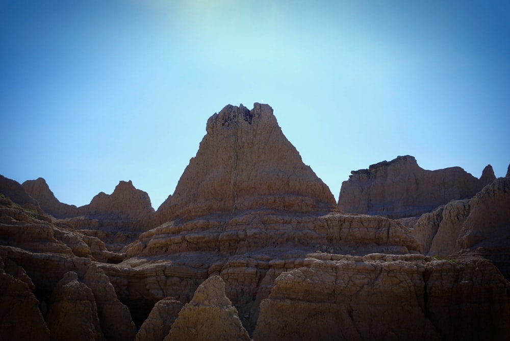 the sun is shining on the mountains in the desert