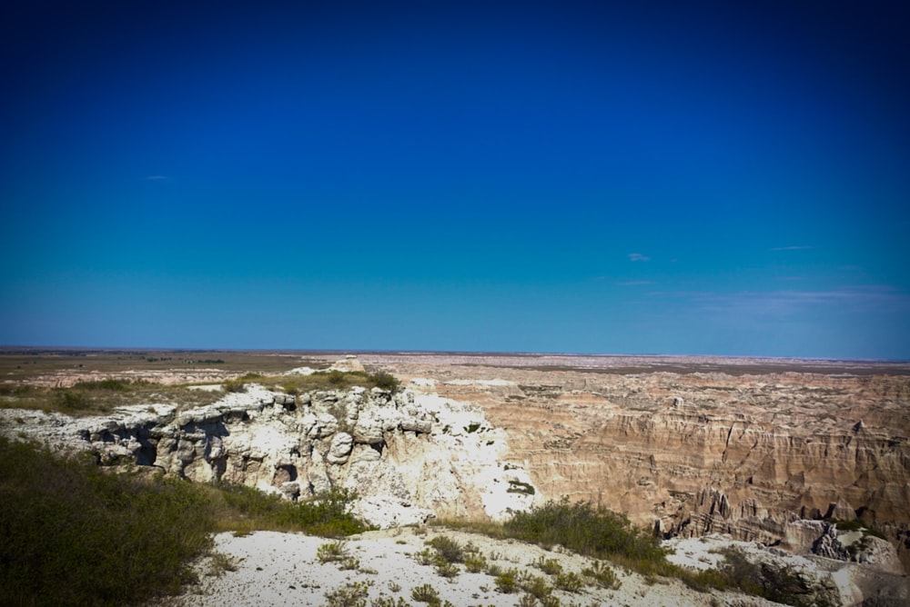 a rocky outcropping in the middle of a desert